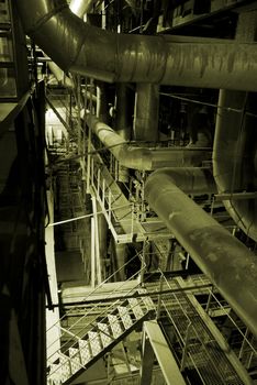 Equipment, cables and piping as found inside of a modern industrial power plant            