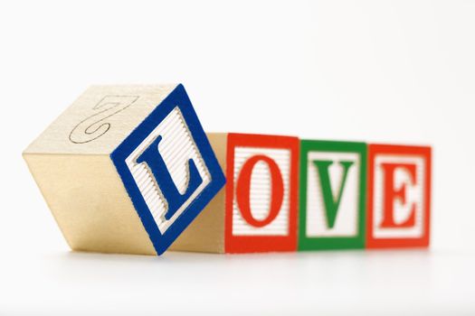 Alphabet toy building blocks spelling the word love.