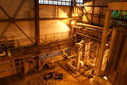 Equipment, cables and piping as found inside of a modern industrial power plant