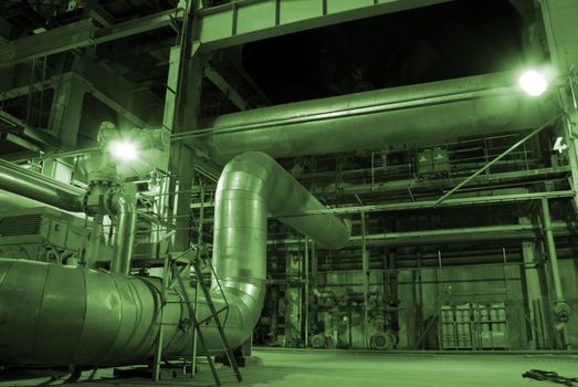  Equipment, cables and piping as found inside of a modern industrial power plant   