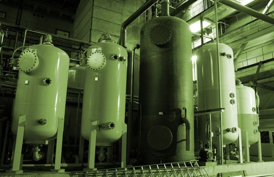 Equipment, cables and piping as found inside of a modern industrial power plant       