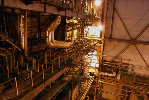 Equipment, cables and piping as found inside of a modern industrial power plant    