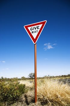 Road sign reading Give Way in rural Australia.