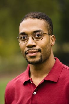 Head and shoulder portrait of African American adult man.