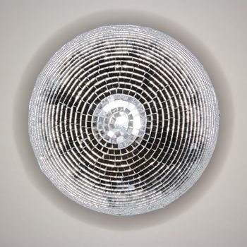 Below view of mirrored disco ball hanging from ceiling.