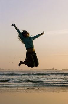 Woman doing exercise on the beach