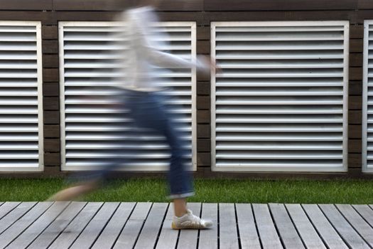 A motion blur abstract of a person walking in a hurry