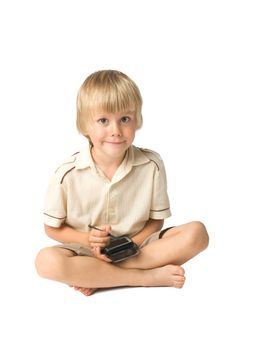 Little boy playing with PDA, studio shot