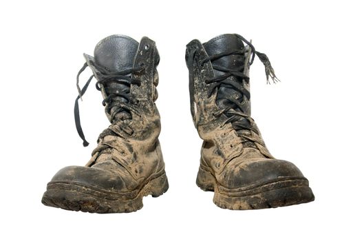 A pait of dirty hiking boots isolated over white