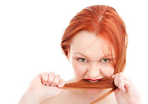 Young redhead woman biting her hair on isolated white