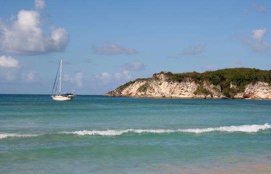 A sailboat docked at a tropical beach, near Punta Cana Dominican Republic.