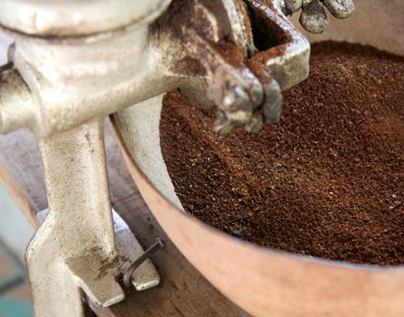 Freshly ground coffee sitting in a bowl.
