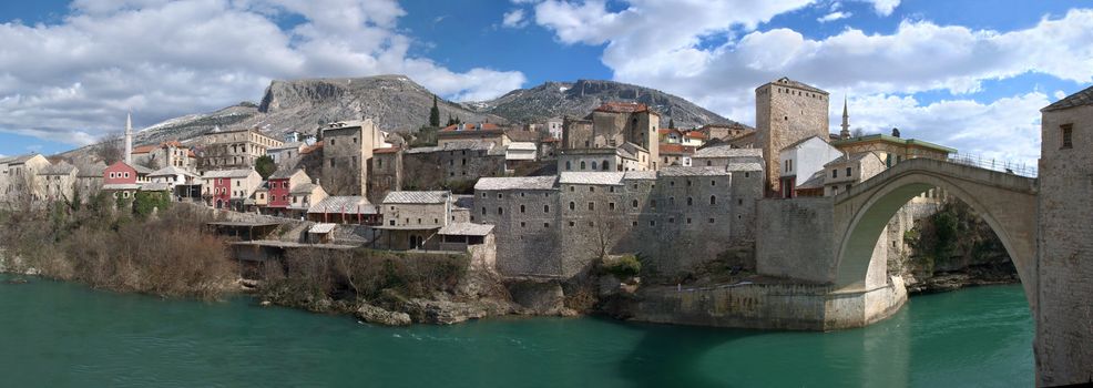 Panorama of Mostar old town east side with Old Bridge on a sunny winter day.