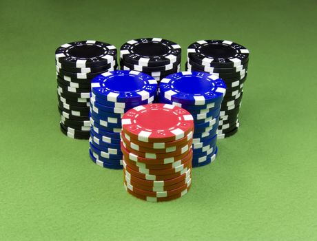 Casino chips over green poker table
