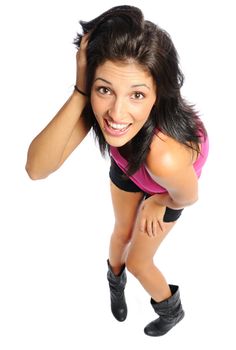 Attractive young hispanic woman in shorts and t-shirt on a white background