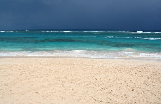 The tropical beach of Punta Cana, Dominican Republic.  Shot on an overcast day.