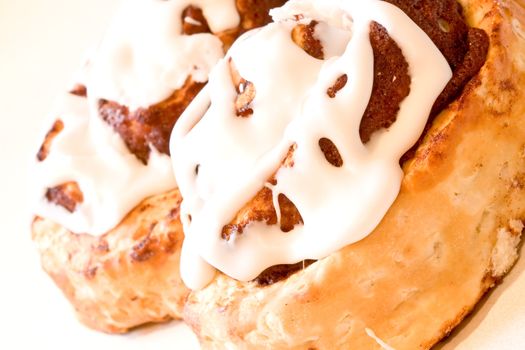 cinnamon rolls fresh and hot close up shot nice icing