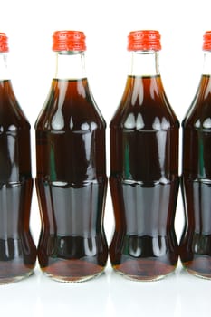 Cola bottles isolated against a white background