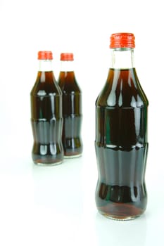Cola bottles isolated against a white background
