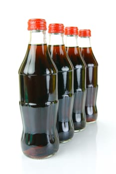 Cola bottles isolated against a white background