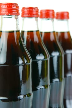 Cola bottles isolated against a white background