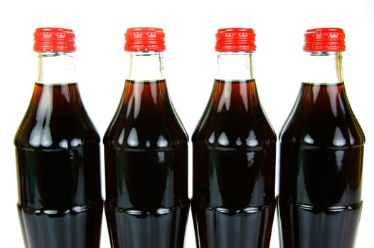 Cola bottles isolated against a white background