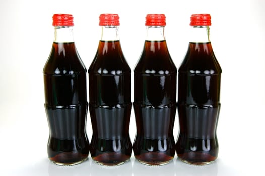 Cola bottles isolated against a white background