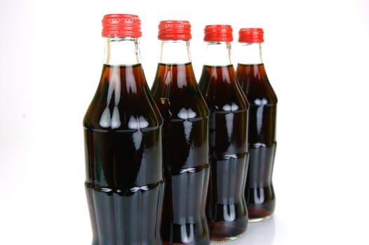Cola bottles isolated against a white background