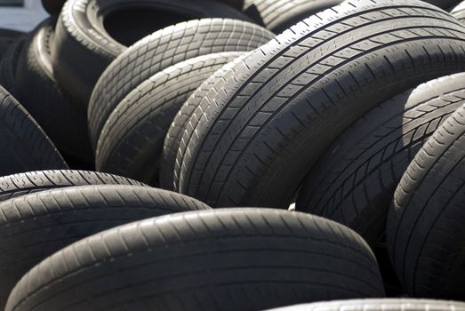 A pile used car tyres awaiting recycling


