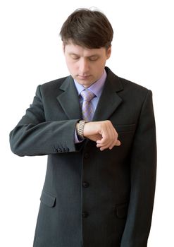 The young man looks at a watch
