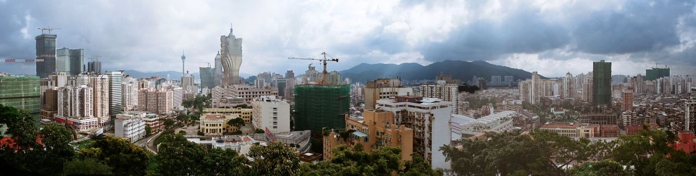 Macau skyline view from a peak,the development of asia's Las Vegas is in progress. The cloudy day makes a uncertain mood.