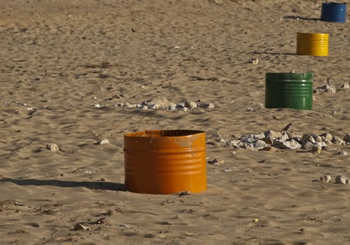 Coloured metal bins beach on the Mediterranean island of Malta