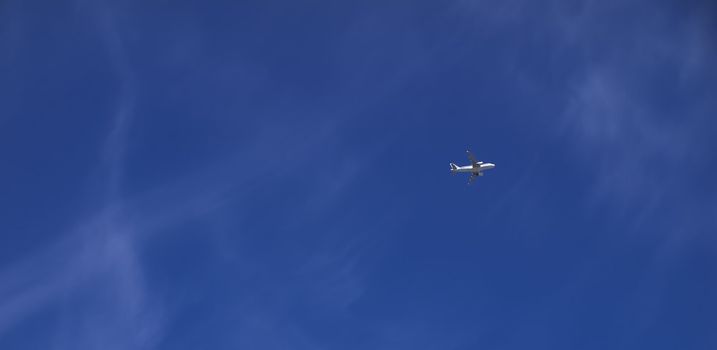 Conceptual image showing civil airliner over blue sky