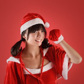 Sweet Christmas girl smile over red background.