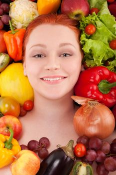 Young girl face framed with fruits and vegetables