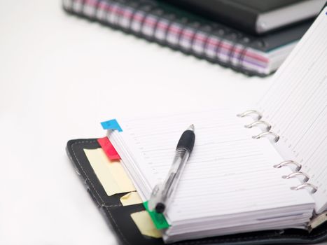 Office stationary - Pen and diary on white background