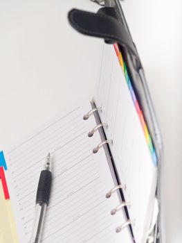 Office stationary - Pen and diary on white background