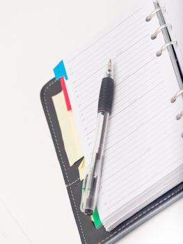 Office stationary - Pen and diary on white background