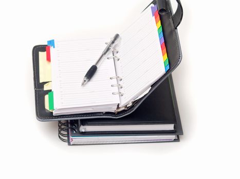 Office stationary - Pen and diary on white background