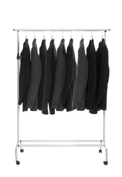 Suits on a Dress Rack isolated on white background