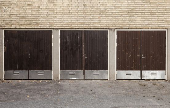 Three Worn Garage Doors outdoor