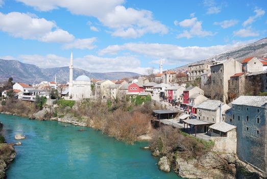 Famous touristic place Mostar viewed from The Old Bridge.