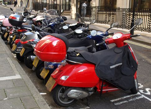 Row of motorcycles parked on a street