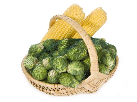 Brussels sprouts and maize-cob in a basket