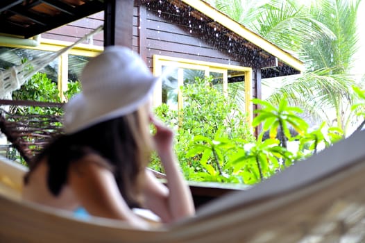 Woman relaxing in an hammock
