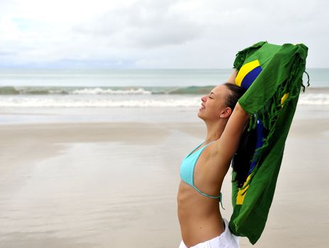 Woman playing with a Brazilian flag

