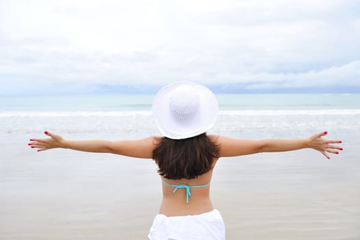 Woman enjoying her holiday in the beach in Brazil
