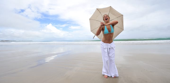 Woman enjoying her holiday in the beach in Brazil
