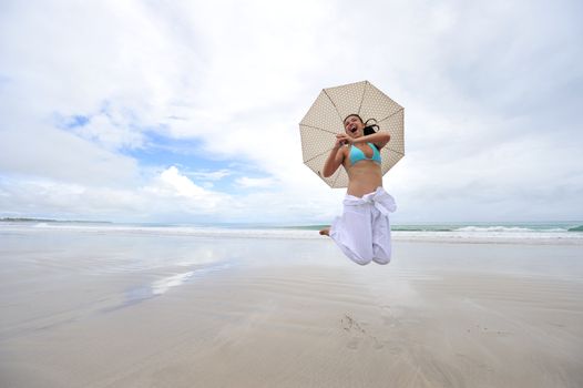 Woman enjoying her holiday in the beach in Brazil
