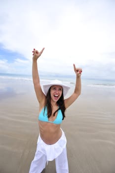 Woman enjoying her holiday in the beach in Brazil
